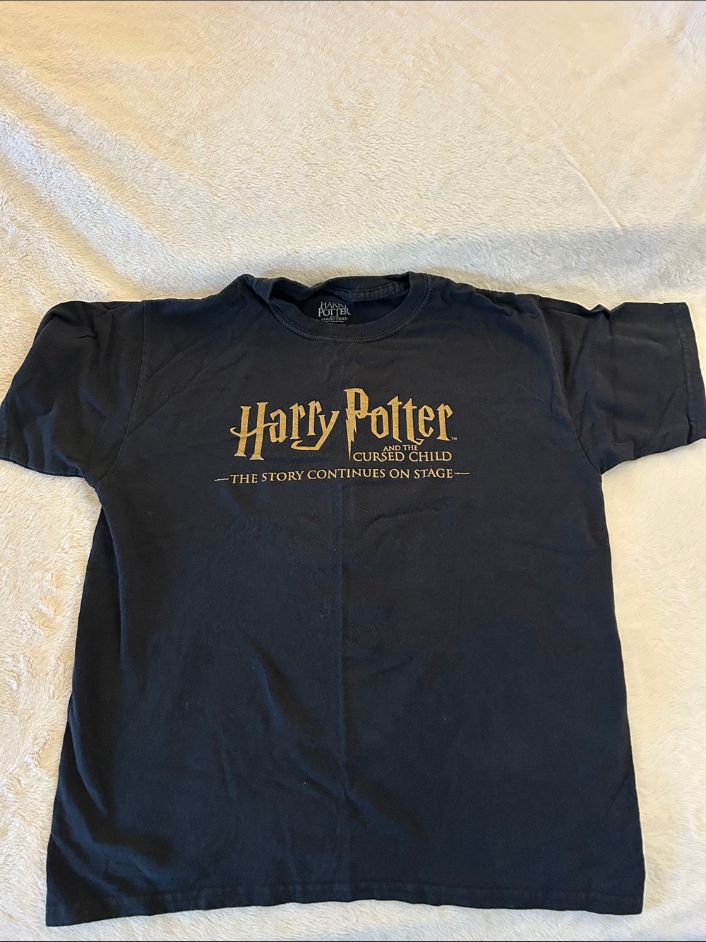Black tee with Gold Harry Potter and the Cursed Child Logo